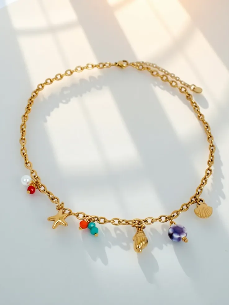 Naszyjnik Atena Charm Sea – złote amulety z motywami morskimi