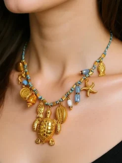 Naszyjnik Atena Charm Sea – złote amulety z motywami morskimi