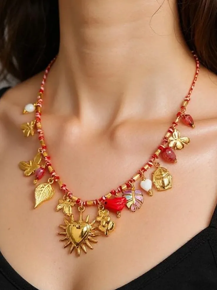 Naszyjnik pozłacany Calista Charmella z zawieszkami z żywicy