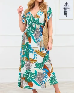 Royalfashion Biała damska długa sukienka z kolorowym roślinnym wzorem