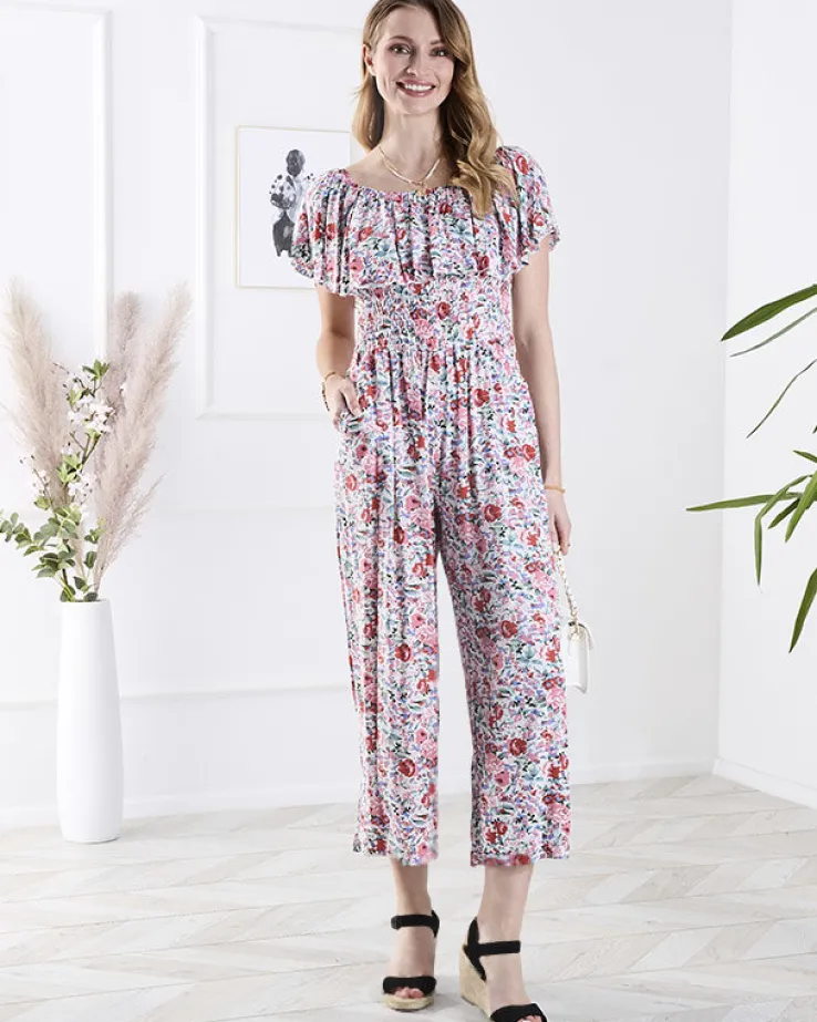 Royalfashion Biało- różowy długi kombinezon damski w kwiaty