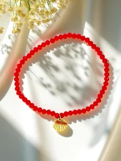 Royalfashion Bransoletka damska z zawieszką muszelki