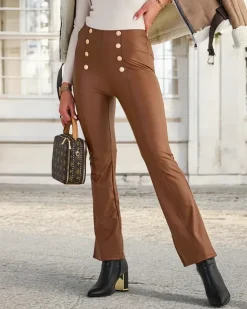 Royalfashion Brązowe damskie eko-skórzane legginsy ze złotymi guzikami