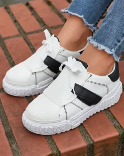Royalfashion Czarno-białe damskie buty sportowe z gumowymi wstawkami Inika