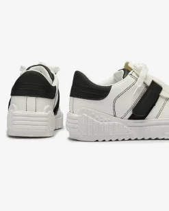Royalfashion Czarno-białe damskie buty sportowe z gumowymi wstawkami Inika