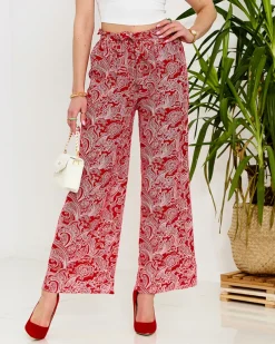 Royalfashion Czerwone damskie spodnie materiałowe z printem