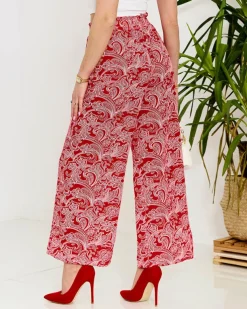 Royalfashion Czerwone damskie spodnie materiałowe z printem