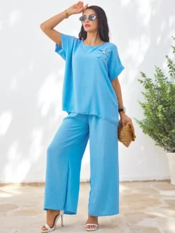 Royalfashion Damski komplet z krótkim rękawem, ozdobnym kwiatem i szerokimi spodniami