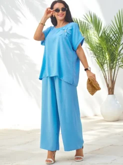 Royalfashion Damski komplet z krótkim rękawem, ozdobnym kwiatem i szerokimi spodniami