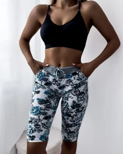 Royalfashion Damskie spodenki 3/4 w białym kolorze i w kwiaty