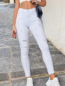 Royalfashion Jeansy damskie rurki z przetarciami