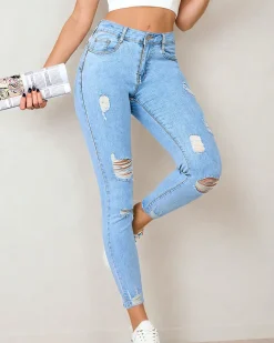 Royalfashion Jeansy damskie typu rurki z przetarciami