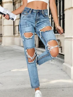 Royalfashion Jeansy damskie rurki z przetarciami