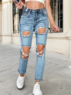 Royalfashion Jeansy damskie rurki z przetarciami