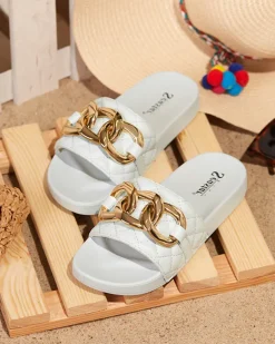 Royalfashion Niebieskie damskie pikowane klapki ze złotym łańcuszkiem Eteris