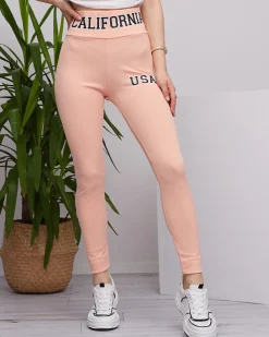 Royalfashion Pudrowe damskie prążkowane legginsy z napisami