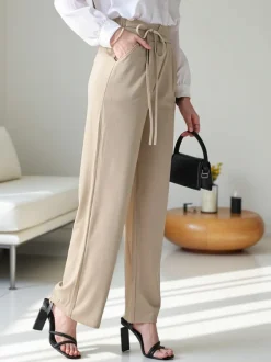 Royalfashion Szerokie spodnie damskie z wiązaniem po boku