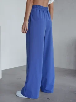 Royalfashion Szerokie spodnie damskie w kant