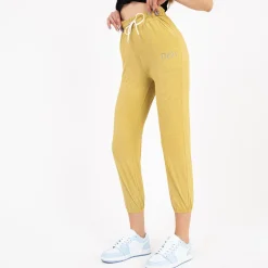 Royalfashion Żółte damskie spodnie materiałowe z naszywką