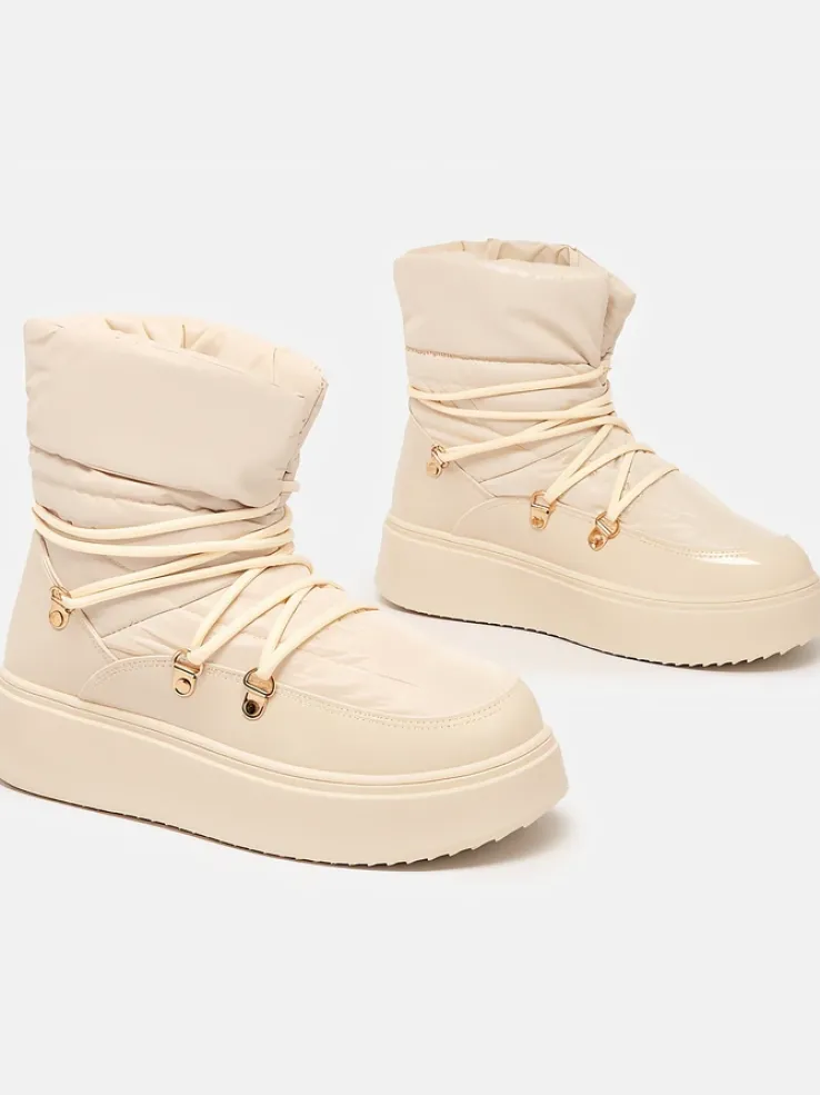 Royalfashion Wsuwane śniegowce damskie w kremowym kolorze Dabenda